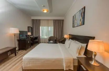 شقق فندقية - غرفة نوم - 2 حمامات للايجار في فندق و اجنحة ازدان - الخليج الغربي - الدوحة
